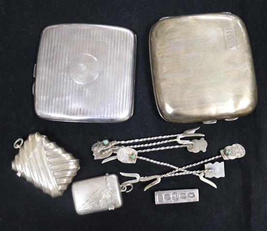 Two silver cigarette cases, two vestas, a silver ingot pendant and six cocktail sticks.